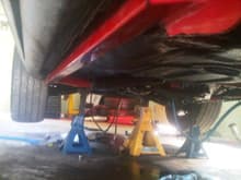 subframe connectors with bottom of car truck bed linered