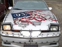 The hood with a torn american flag that states "Our Nation Will Eternally Honor The Heroes Of Flight 93".