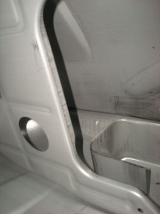 Left of the pump tray.