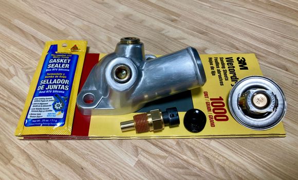 Temperature Coolant Sensor $0.00, Thermostat $0.00, Thermostat Housing $16.53, Thermostat Housing Bolts $4.83 (not pictured) and Thermal Vacuum Switch Plug $4.54