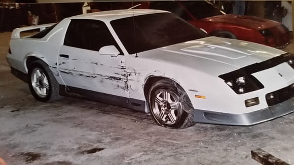 I wrecked this one, too.....and this car was damn near cherry before the accident, too. 1992 Z28, 80k miles, 305 TPI and a 5 speed.  I had a Stealth Ram 350 in the works for it, and it was going to be all white with pearl orange heritage stripes with orange emblems. I had 17" ROH wheels for it, too. Then this happened..

1984 Z28 in the background, 305 HO, auto, 80k miles
