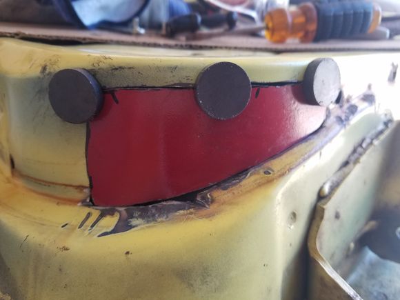 Patch cut from sheet metal on the parts car.  Shaped and formed to fit.