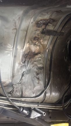 Damage from a past trans explosion.  Still have a piece of the aluminum drum stuck between the car and subframe rails.