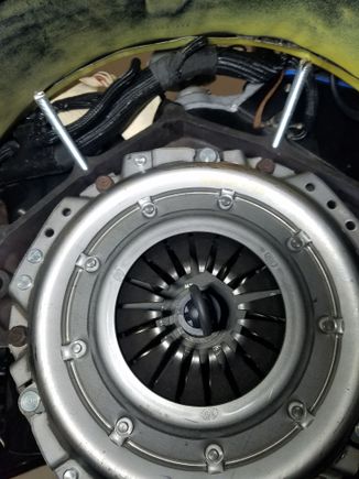 Shot of the clutch install.  I had initially thought the bellhousing would be attached to the transmission, then bolted to the block, so I created to guide posted to help with the install.  I then realized there was no way to install the clutch fork and throwout bearing using this method, so followed by mounting the bellhousing.