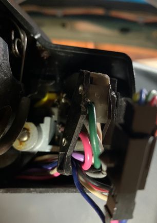 Right about the light gray piece with the button is where this piece will slip or “key” into. 