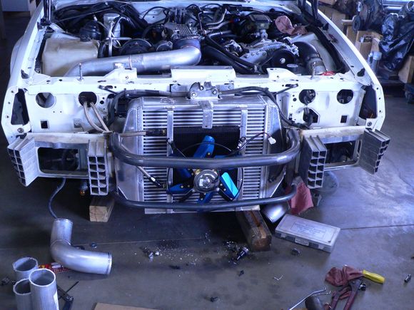 Reworked the front bumper some the replaced lost strength with tubing and welded her up. Also dumped the split grill insert on the nose and fabricated a full flow grill the full width of the opening for more air.