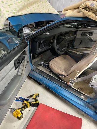 Interior is gray, the driver's seat is tan