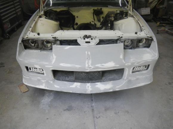 Blocking on the front bumper cover and spoiler.