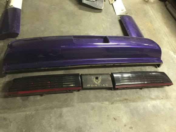 Grid tail lights and filler panel/back bumper.