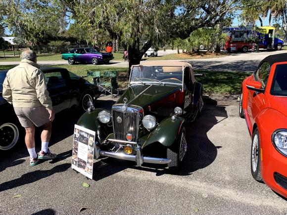 Love the green color. See the purple Vega in the background.  He put a 350 in it.  I remember a buddy of mine in high school did the same thing.  Vega, man that was a long time ago...
