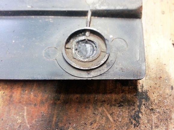 Studs removed with needle nose and holes ground down with a carbide bit.