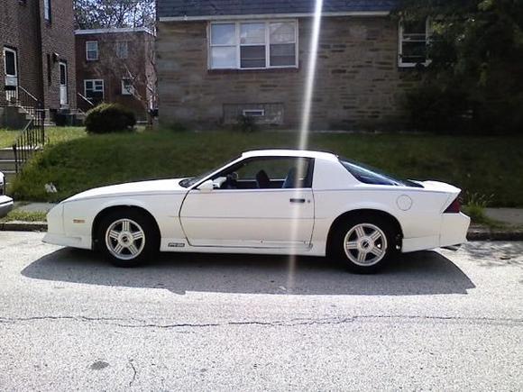 My car the day after I bought it, no mods except for some blue seat covers. Oh, and the exhaust :]