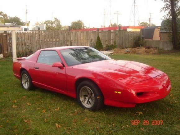 This is a 1992 Pontiac Firebird Formula.
The main difference is that I purchased off Ebay the ground effect kit from the same year non-Formula. There was many brackets and holes to be made in order for the kit to fit correctly. However it was pretty straight forward since the design already fit the car. I also had to buy a new hood and qaurter panel due to a minor front collision. If you have ever searched for a original cal induction hood you will find that they are not easy to get your hands on. So I had to go with the standard hood. Which turned out well enough for me. It turned out almost like stock.
My very first car when I was 17 was a  1992 Pontiac Firebird GM red with the same ground effect kit with the gold rims and the Ttop. 
So I decided that I wanted to merge my first car with my new Formula.