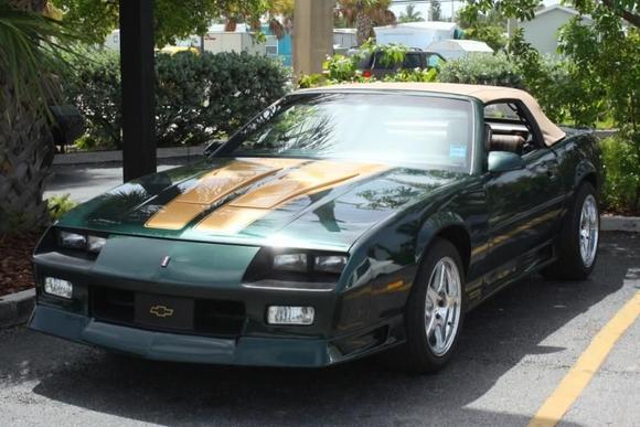 Blisters w/ painted stripes, diamond cut turn signals, and 'angry' eyes.