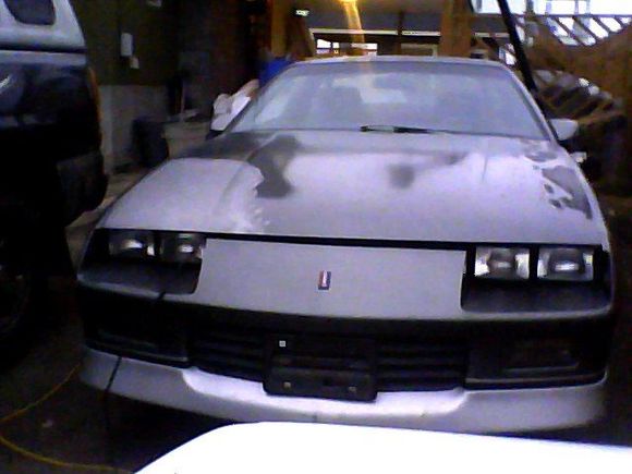 front of car with battery charger cable coming out oh yeah