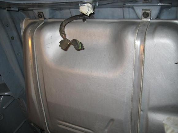New Spectra fuel tank with straps. The tank was painted with rust proof paint. I used one sided sticky foam as insulators between the straps.