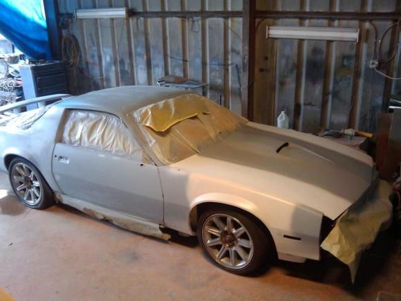 Getting closer to black. Laid the tail on it to check the look. I had the two support fins removed and the tail fiberglassed solid. I like the clean look of it. Also had the hood scoop added.