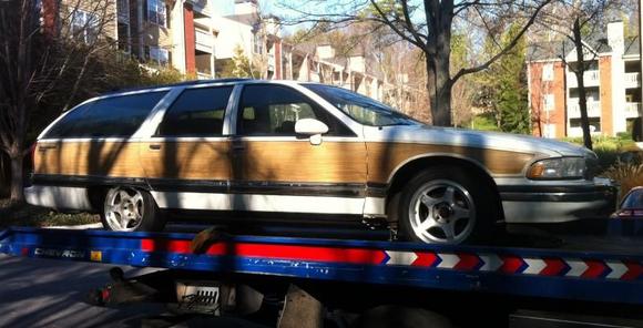 Wagon on a flat bed being hauled from my apartment to my new house.
