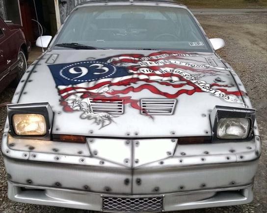 The hood with a torn american flag that states "Our Nation Will Eternally Honor The Heroes Of Flight 93".