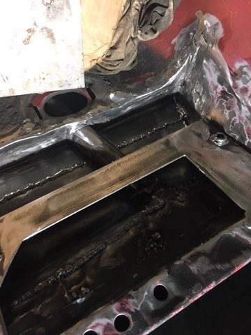 Close up, new seat frame integrated with sub frame connector. Tunnel sheet metal had to be moved to allow seat to slide all the was back.  