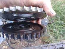 Old timing gear has much more offset away from block than the new one. New ones rubs on bolts next to camshaft.