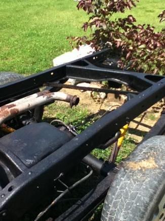 Putting Eastwood Rust Converter on the frame. The old dual exhaust rusted off.