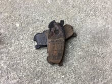 Yep, the rear brake pad actually flaked off the backing plate.