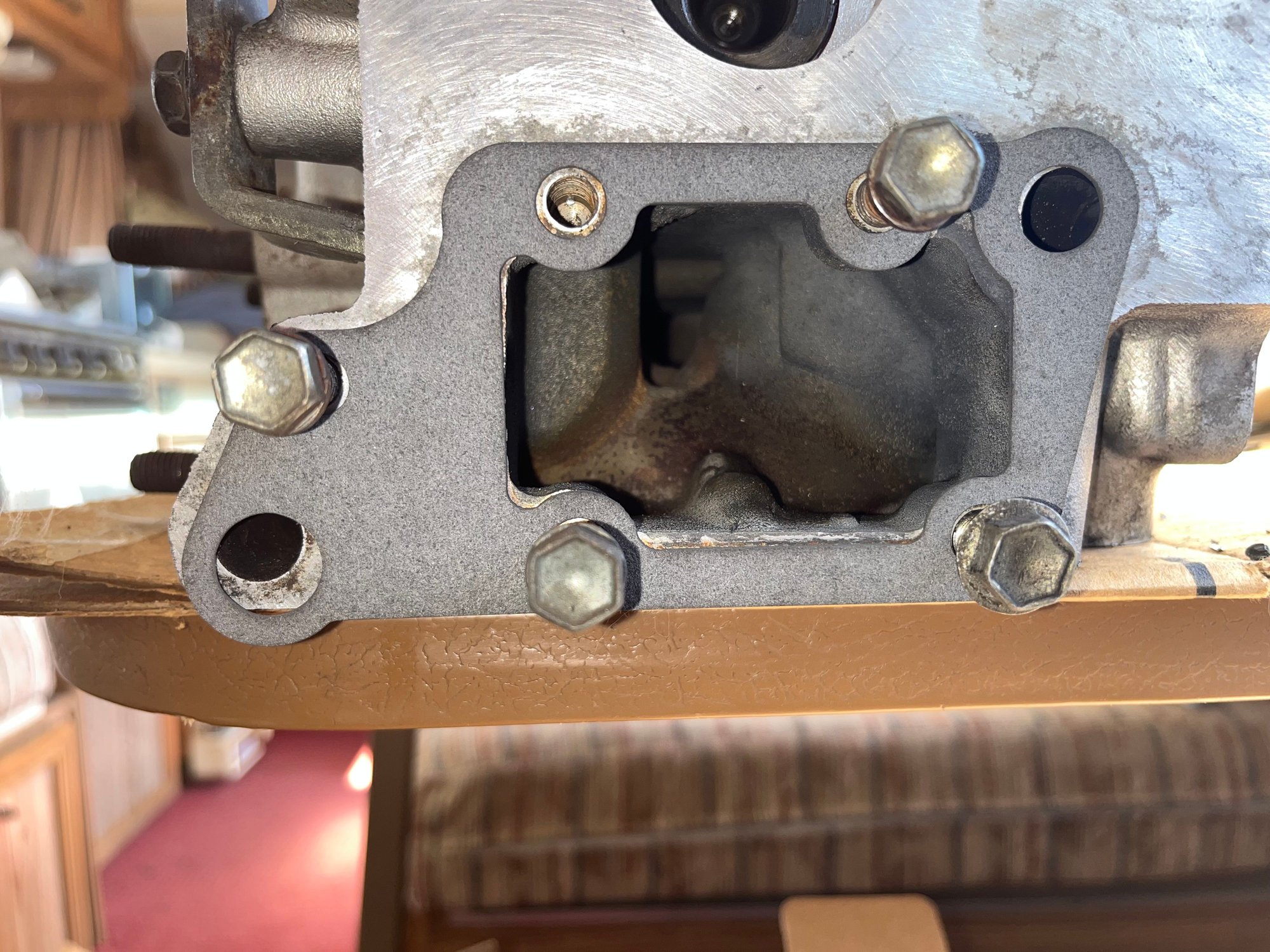 Back side of head, 4 out of the5 bolts in place to show alignment lower water passage not aligned.