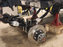 This photo feels like a misrepresentation with the time involved to get the bushings,shackles,leaf springs,axle all bolted together. Had the axle on a small cart, fortunately the truck was already high enough to roll it under the springs. Getting the axle high enough to catch the ubolts, and get the leaf spring pins lined up definitely takes a little bit.
