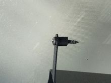 I used a small piece of vacuum hose as a spacer on each.mount ing screw.