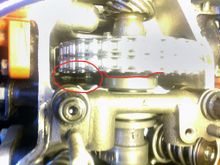 This is where you can see I installed the old cam sprocket backwards and the area circled in red is where the chain was rubbing from not having the correct backspace.  This was corrected when I installed the new adjustable cam sprocket