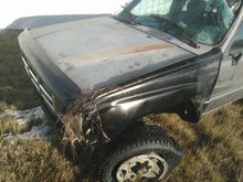 The tire dislodged during recovery im pretty sure it was still "round" while upside down. Fender mangled but not ripped.