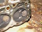 Stuck burned valve. There was so much blow-back and carbon/fuel deposits in the intake I am surprised the engine was still running.