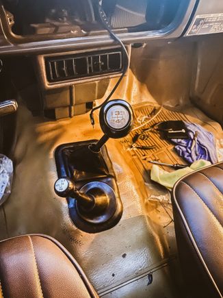 Mission accomplished. I had tried to take it off for months while it was in my truck, would not budge even with a heat gun. This afternoon I ended up listening to some advice on here, drilling in the top and adding penetrating oil, then finally just took a hack saw to get down to the hard plastic (it was indeed super glued on) picked away at it and then smashed it with a hammer and it came off. I was able to add the boot and new knob. Yotatech community for the win!!  Thanks y'all :) 