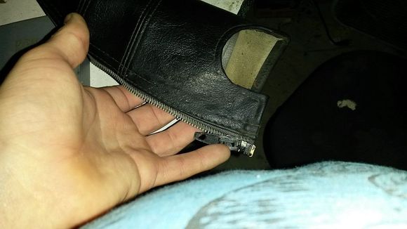 after vinyl repair liquid not too bad really no sign of the tear which would have run along the line of my mid finger from the inside heading towards the zipper