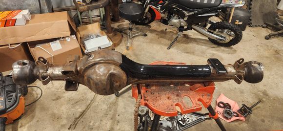 Top of axle and inside of truss painted before truss gets welded on.
