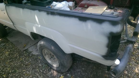 this fender was a pain in the butt.  Rusted through with a softball sized dent.  Popped most of the dent out and even did some old school heat gun / ice work to tighten the metal back up, then  painted with a rust stop, and glassed with what my buddy Duey calls Kitty or Tiger hair but is just Bondo hair - short strand fiberglass that mixes just like bondo and hardens up QUICKLY - same stuff I've been using to fix the dash and do the speaker C / A pillars.