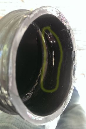 crack shown in yellow  circle, but filled in with Shoe Goo