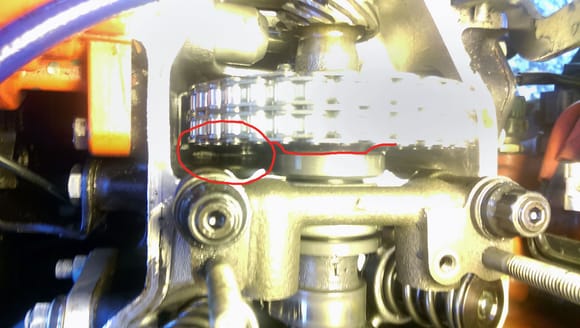 This is where you can see I installed the old cam sprocket backwards and the area circled in red is where the chain was rubbing from not having the correct backspace.  This was corrected when I installed the new adjustable cam sprocket