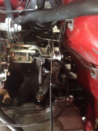 See where I slathered it with white lithium grease? There's supposed to be a bushing there. The throttle cable is fine.