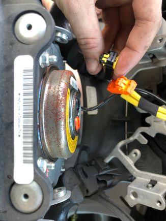remove the two wires from the back of the airbag by pulling out of the yellow tabs, and pulling straight back on the connectors.  