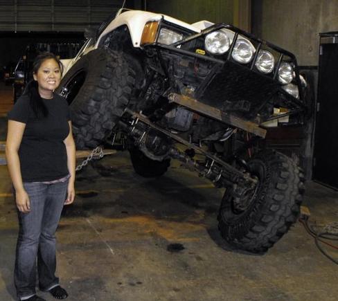 my g/f next to my rig in the shop first time I flexed it
