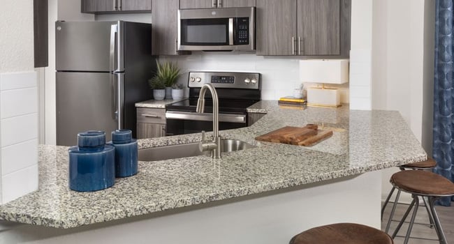 Kitchens feature granite countertops and 42&amp;quot; cabinets